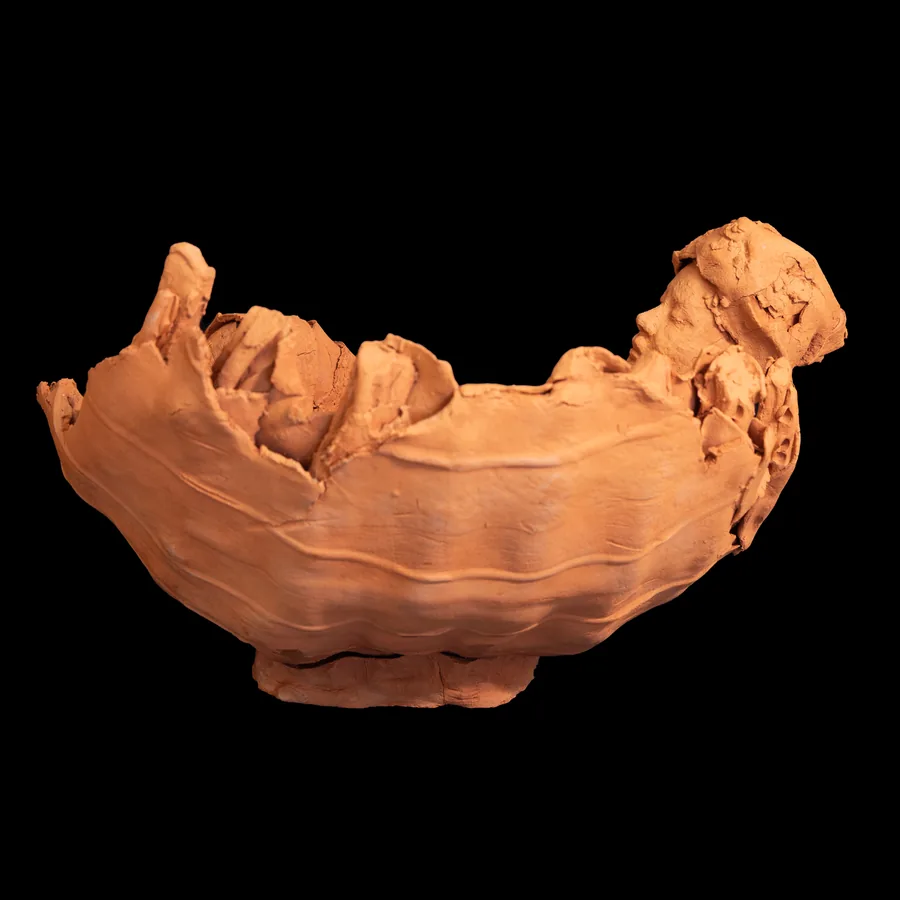amai, red stoneware vessel with a reclining female figure along its rim, side view