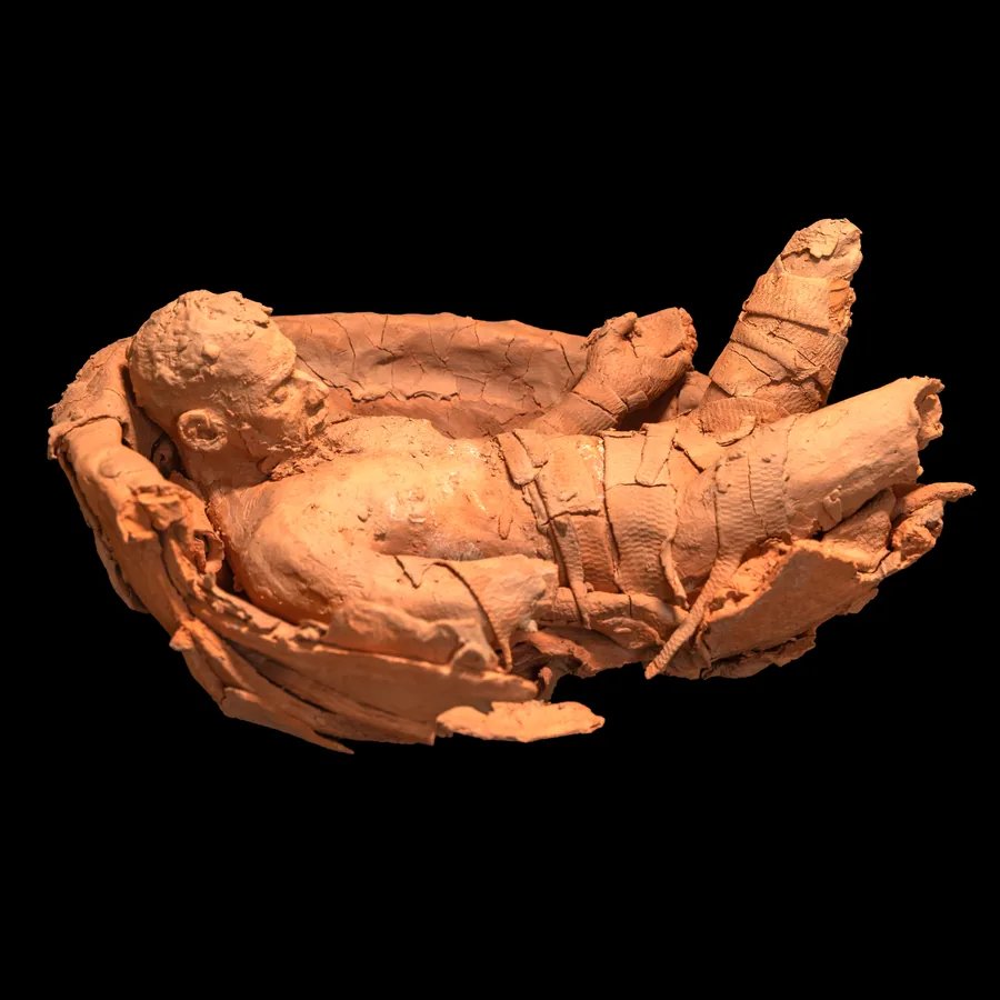 arkard, the reclining figure in its red stoneware bowl, seen from above