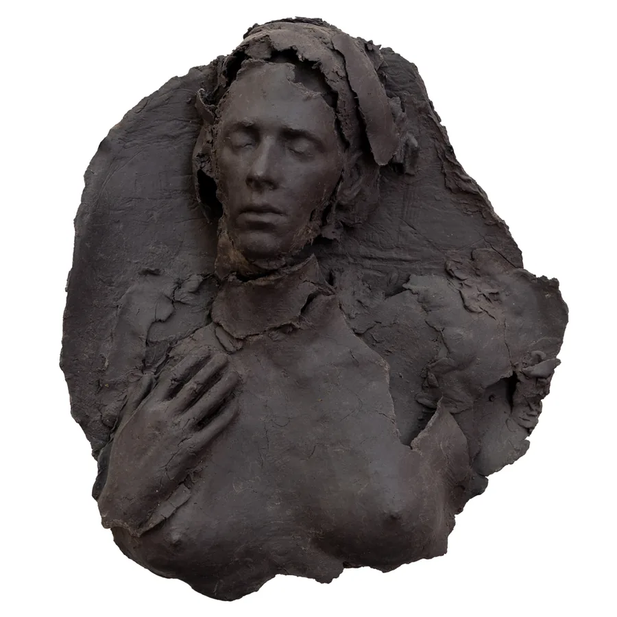 cala, black porcelain relief of a figure with closed eyes, one hand resting on the chest, front view