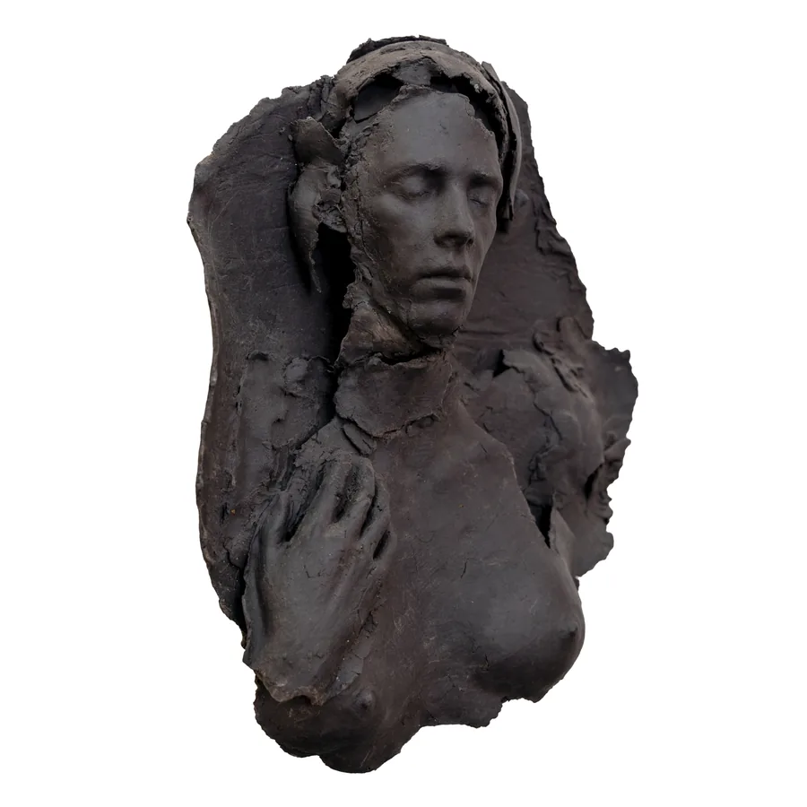 cala, black porcelain relief of a figure with closed eyes, one hand on the chest, three-quarter view