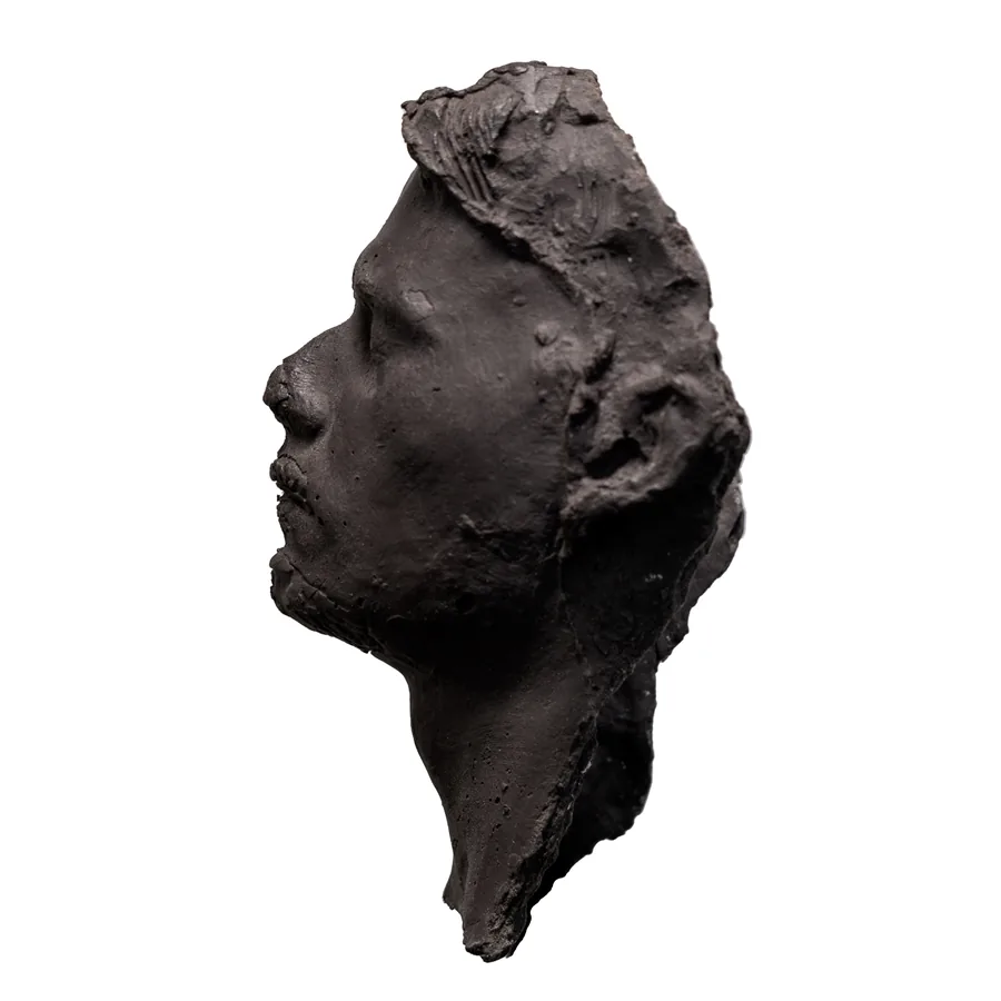 quietus, black porcelain head in profile