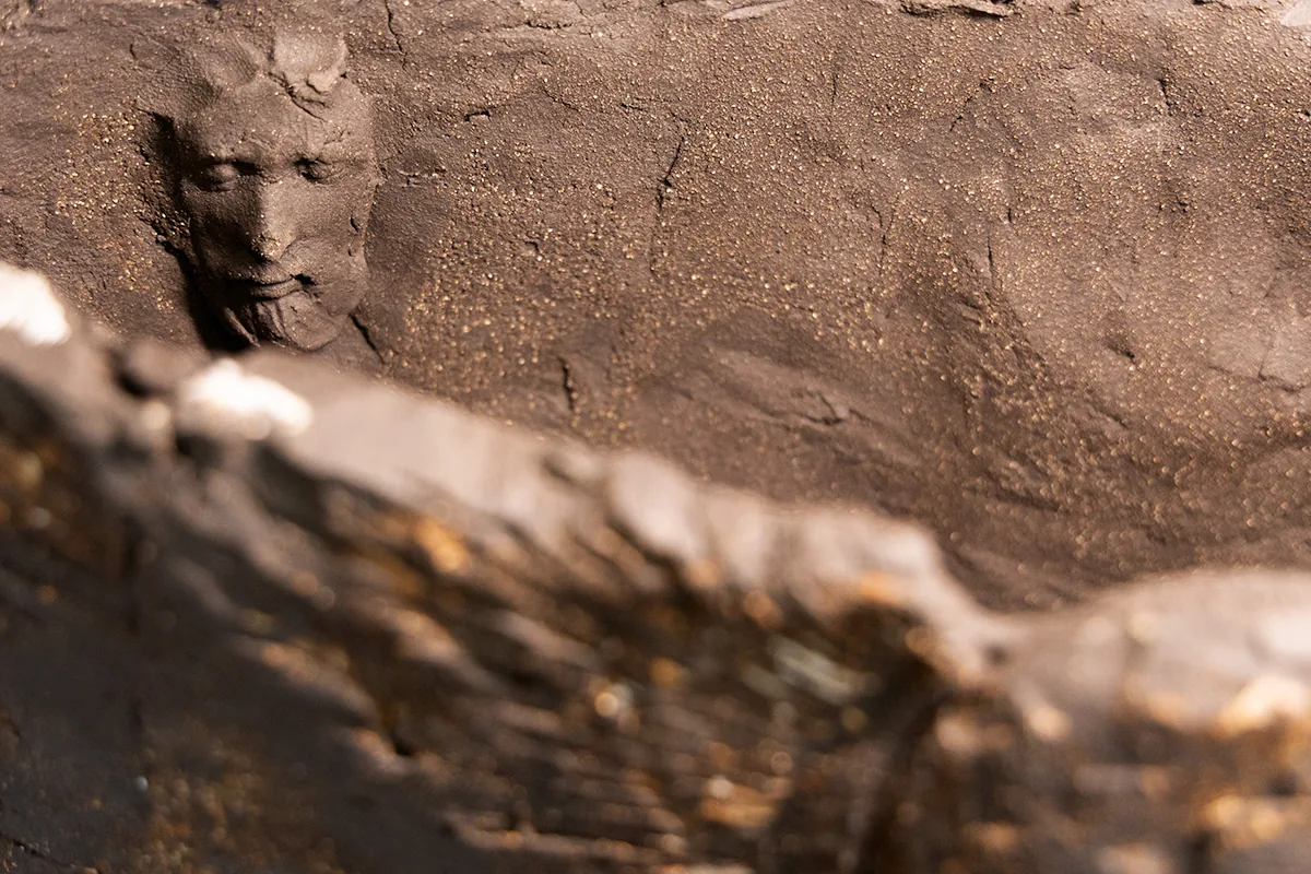 fan form 3, signature: a small face modelled near the rim