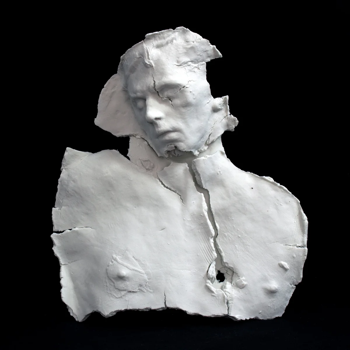 emrys, white porcelain head and torso, broken and reassembled, eyes closed