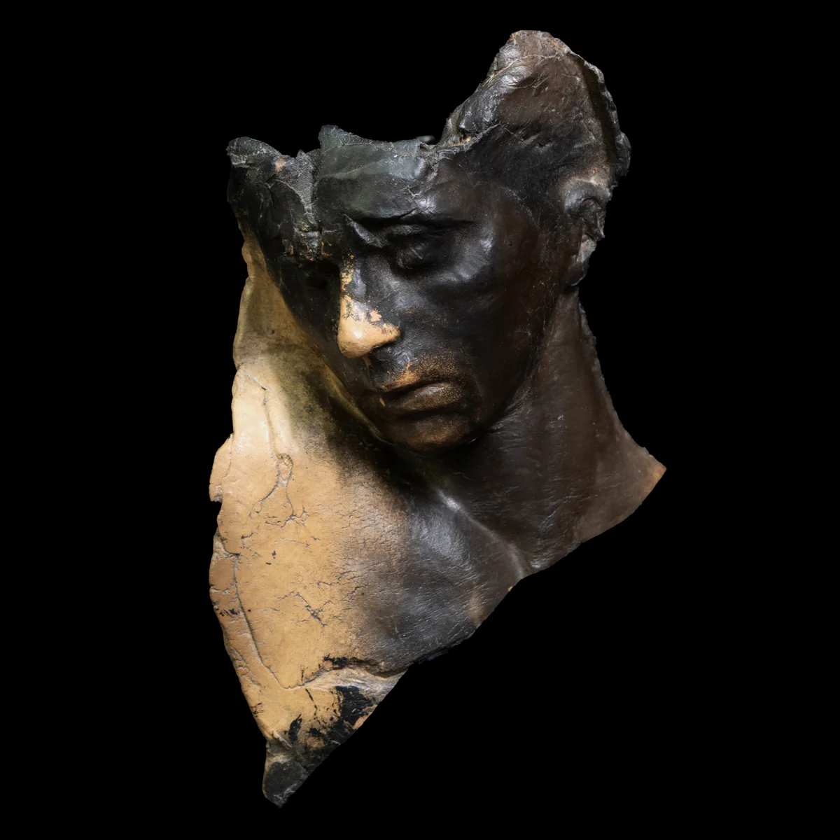 portrait study ii, smoke-fired terracotta face with closed eyes, darkened except for the nose and lips